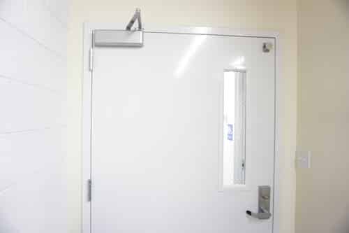 white metal door with door hardware