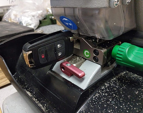 image of a laser key cutter duplicating an automotive flip key